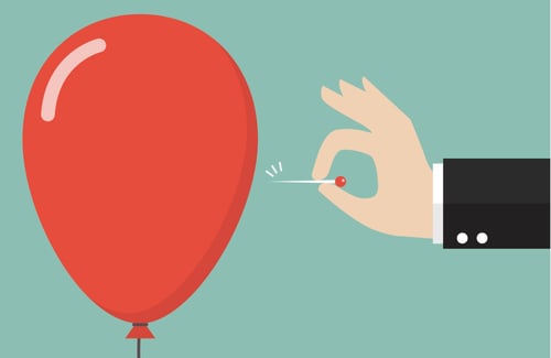 hand-pushing-needle-to-pop-the-balloon